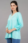 Aqua Solid Flared Embroidered Top